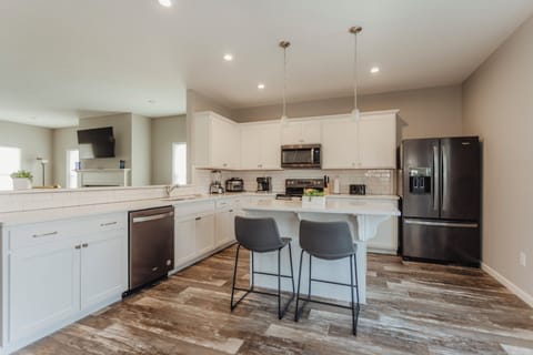 Large kitchen with bar seating for two
