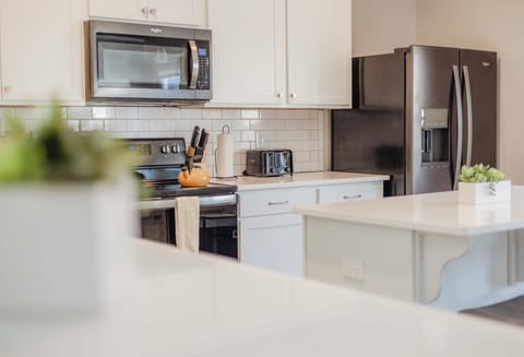 The open concept kitchen is bright and welcoming.