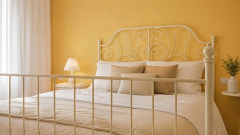 Bright and Cozy Bedroom with Elegant Iron Bed