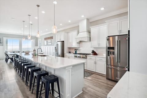 The kitchen island provides additional counter space for serving snacks or meals