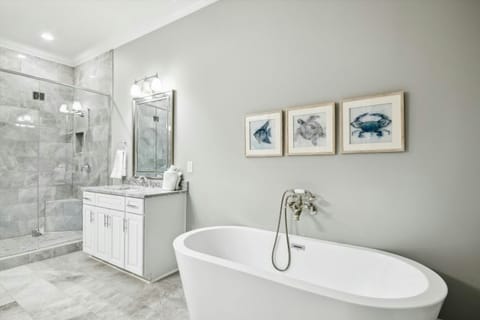 After a fun day on the beach, sink into the soaker tub with a glass of wine.