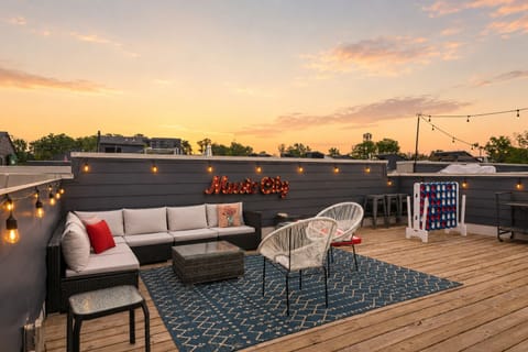 Rooftop sunsets with cozy seating and Nashville skyline vibes.