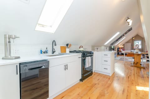 Full kitchen with range/oven, dishwasher, and refrigerator
