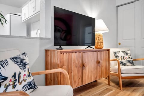 Cozy living area w/ TV, warm wood accents & comfy seating for laid-back movie nights.