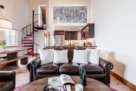 Living Area with Gas Fireplace, Leather Sofa, and Smart TV