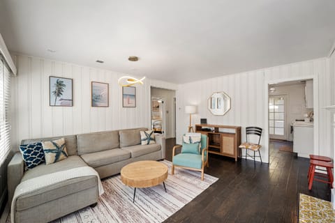Step into the spacious living room of your coastal retreat.