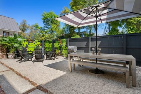 Private backyard space with dining seating and a fire pit hangout!