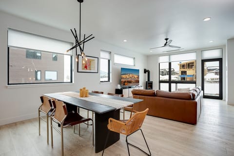 Relax in your stylish open-plan living space where contemporary design meets comfort—perfect for memorable evenings with loved ones.