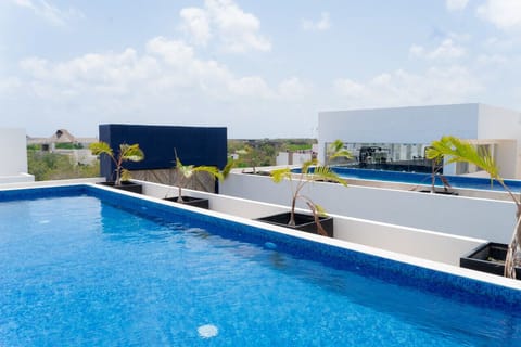 Dive into relaxation in our sparkling swimming pool