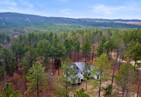 Escape to tranquility and immerse yourself in nature at our secluded retreat. With panoramic views of the lush forest and rolling hills, this spot is perfect for a serene getaway.