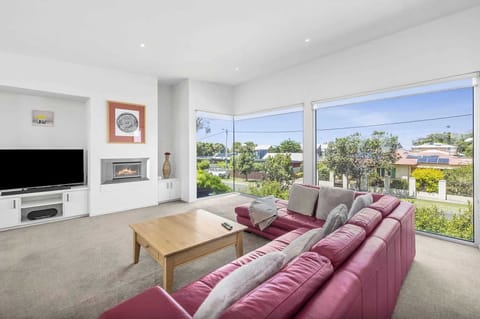 Keep cosy by the fire in and watch ships sail the horizon and storms roll in from the living room and its expansive windows