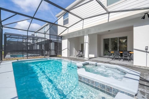 Private screened pool and spa with covered lanai