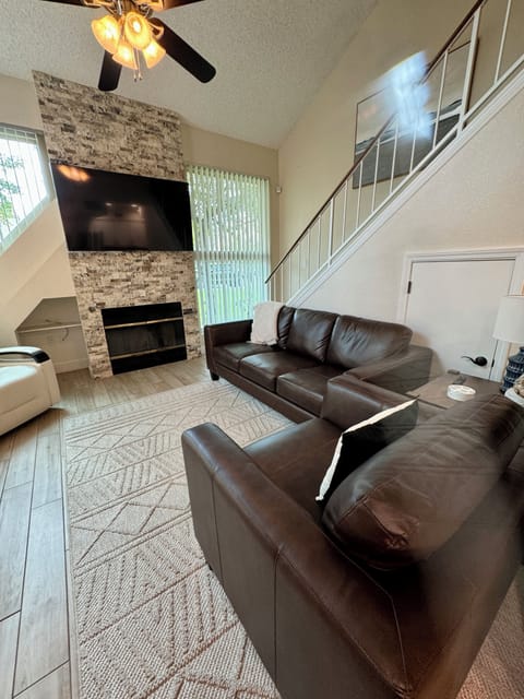 Living Room with fireplace and 70" Smart TV
