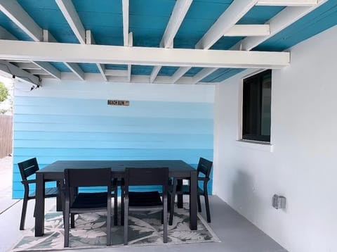 We just finished creating a gorgeous blue ombre wall outside the house. We also set up a big outdoor table for everyone to gather around and enjoy meals.