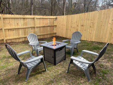 Private fully fenced yard area with fire pit, enjoy a cozy night with friends.