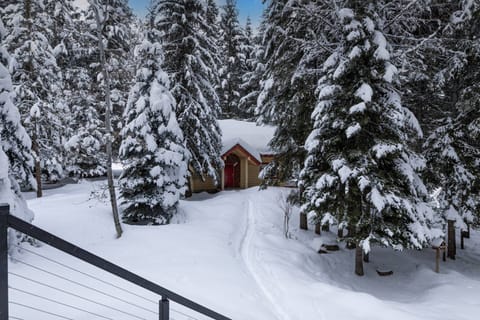 The charming guest house offers a cozy living space, a kitchenette, full bathroom, two bedrooms, and deck overlooking the tranquil pond.
