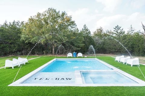 Outdoor pool area and hot tub