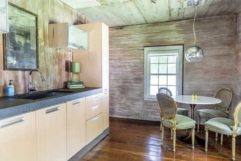 Kitchenette equipped with a mid side refrigerator and freezer, microwave, Keurig, basic dishes and utensils.