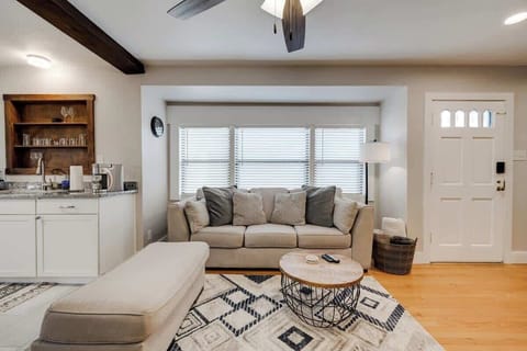 Inviting living room with comfy seating, warm décor, and a seamless flow into the kitchen