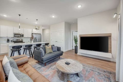 Immerse yourself in the ambiance of our sunlit open floor plan, where culinary spaces seamlessly blend with chic living areas.