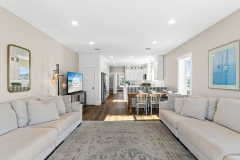 Relax in this bright, open living space with comfortable seating flowing seamlessly into your fully equipped kitchen and dining area.