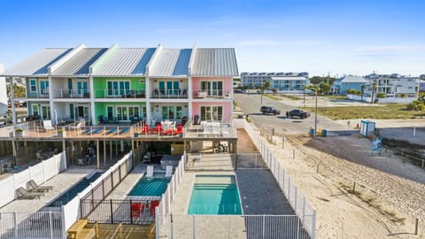 Colorful beachfront vacation rentals featuring private pools and direct beach access for the perfect coastal getaway.