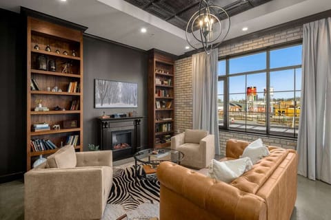 Living Room: Plush leather couch and two accent chairs provide ample space to lounge and watch your favorite show.