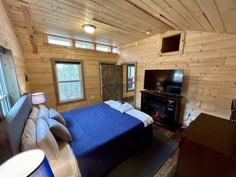 Main Bedroom with electric fireplace.