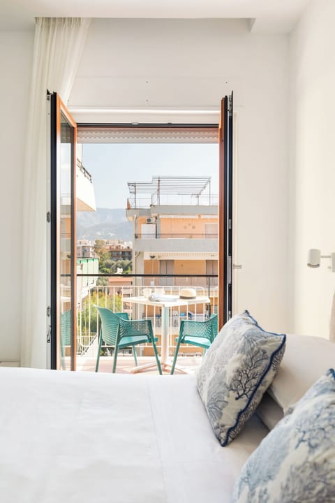 Deluxe Room, Balcony | Minibar, in-room safe, desk, free WiFi