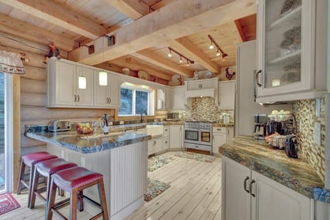 Large kitchen for multiple cooks and bar to entertain while you prep - second level