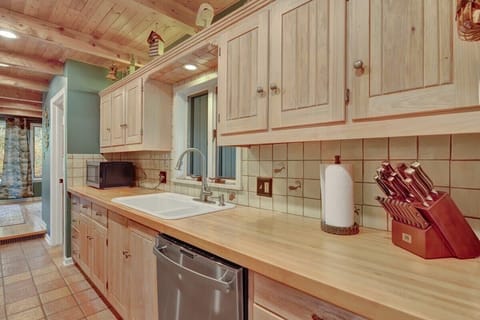 Well stocked kitchen with high end appliances and abundant natural light