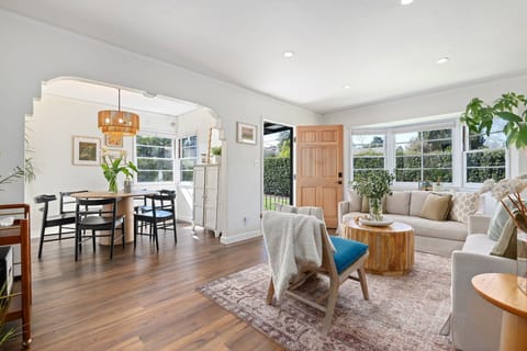Living room and dining room with bright open windows
