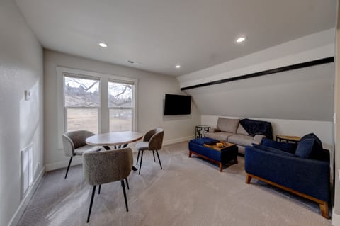 Living room comfort with 55 inch TV and cable TV.