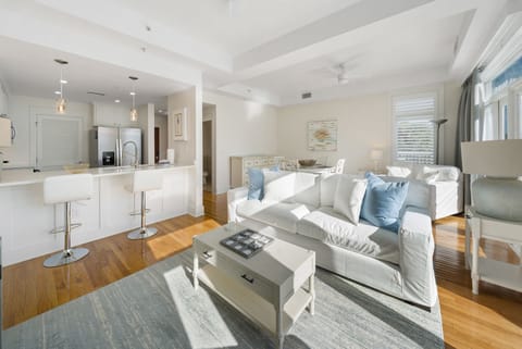 Settle into your bright, airy living space with plush seating and an open kitchen perfect for preparing meals together.