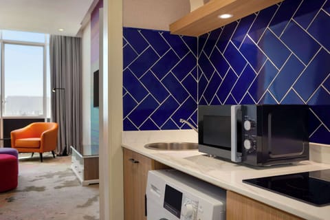 Suite, 1 King Bed, Smoking, City View | Premium bedding, minibar, in-room safe, desk