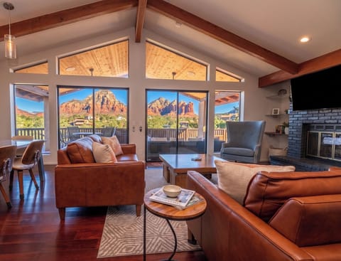 Relax on comfortable sofas in living room, featuring unobstructed red rocks