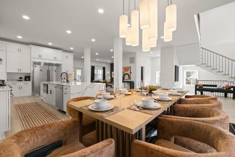 A stunning, modern dining area set for an elegant gathering.