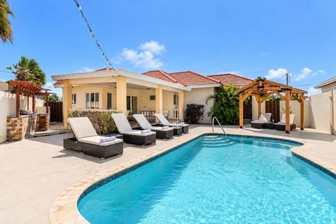 Revel in the grandeur of Opal Breeze pool retreat. An expanse of relaxation and luxury, where the cool waters invite you to unwind, and the abundance of lounge chairs ensures every moment is bathed in comfort.