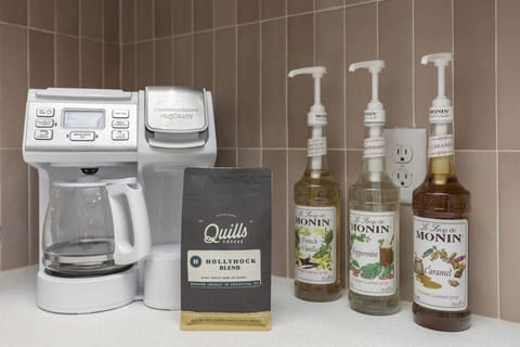 Kitchen with basic cookware and utensils. Comes with cups and glasses and plates. Complimentary breakfast includes custom hollyhock blend coffee from local roaster, k-cups, and tea. Breakfast bars, oatmeal, and popcorn are there for your enjoyment!