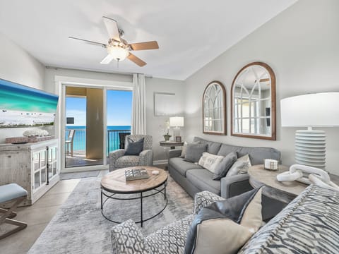 Sink into plush seating while ocean breezes flow through your bright living space, where stunning turquoise views await just beyond your private balcony.