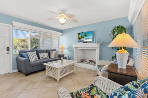 Cozy living area with patio access and beach views. Just steps away from Longboat Key Beach.