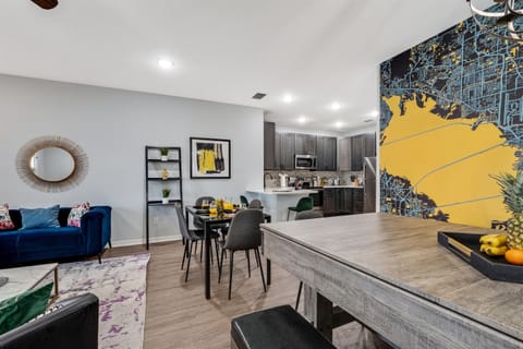 Welcome to our elegantly designed dining area, featuring a stylish 4-seater table strategically positioned to seamlessly connect with both the living and kitchen spaces.