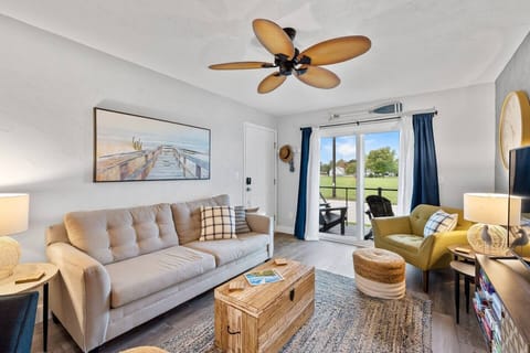 Bright, airy living room filled w/ natural light & comfy seating to relax together.