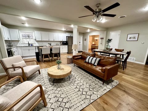 Large, open floor plan with clear views of living room, kitchen, and dining area