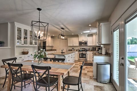 Open kitchen and dining area with full appliances and a dining table