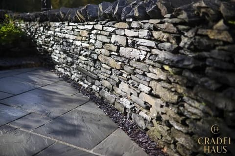 Step into the shared outdoor oasis at Fair Rigg, where historic Lakeland stone walls embrace the surroundings. Discover a charming escape, blending heritage and nature in the heart of the Lake District.