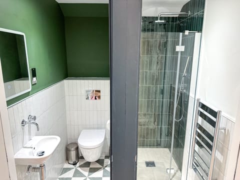 Shower, rainfall showerhead, towels, soap