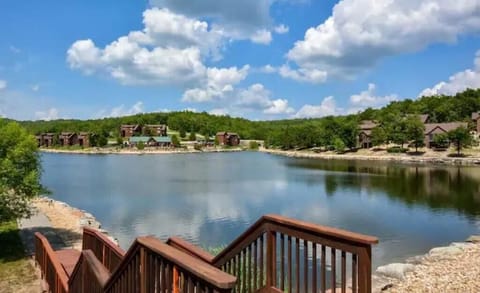 Fishing lake with walking path. Adjacent is the pool, sand court, and basketball
