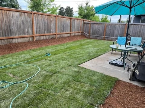 Landscaped backyard, great for breakfast, coffee or just relaxing with a book.
