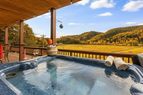 Relax in the hot tub while enjoying the scenic mountain views from the covered deck.